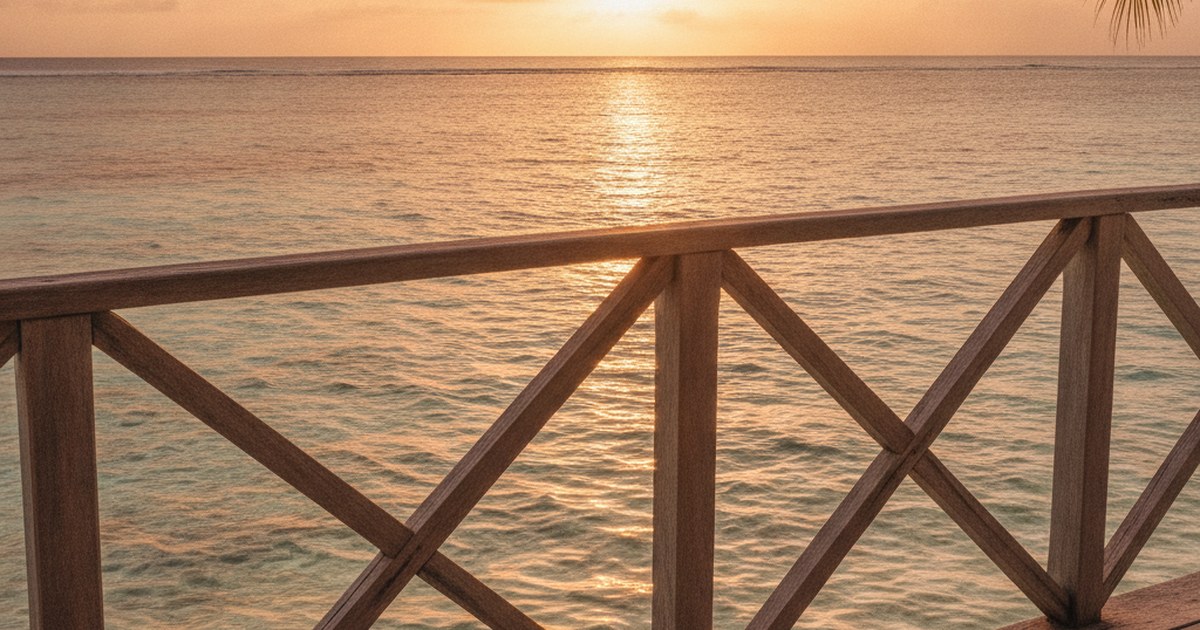 Turquoise tropical water and palm shadows seen from a lanai at golden hour