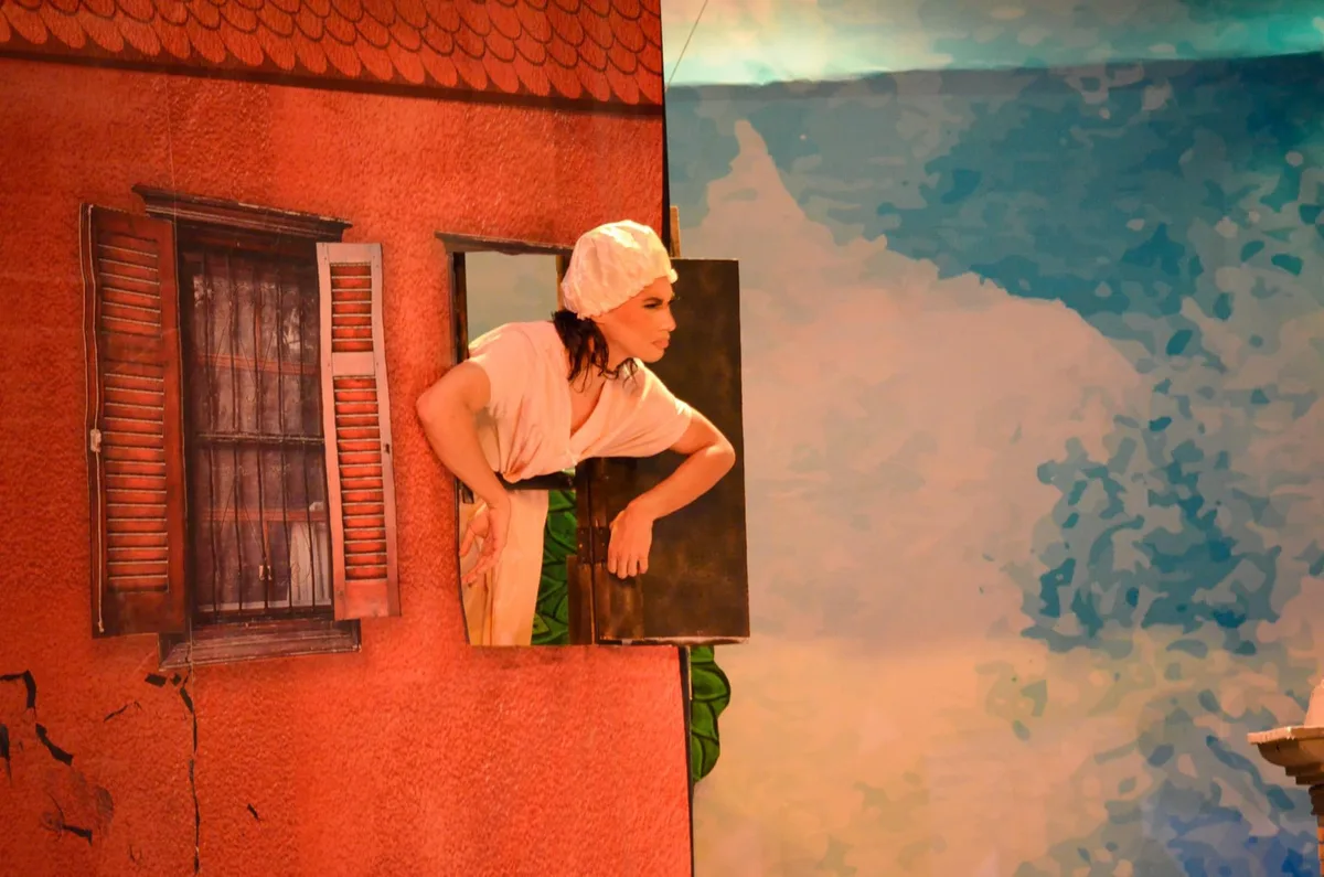 Vlad as Widow Simone peeking from window