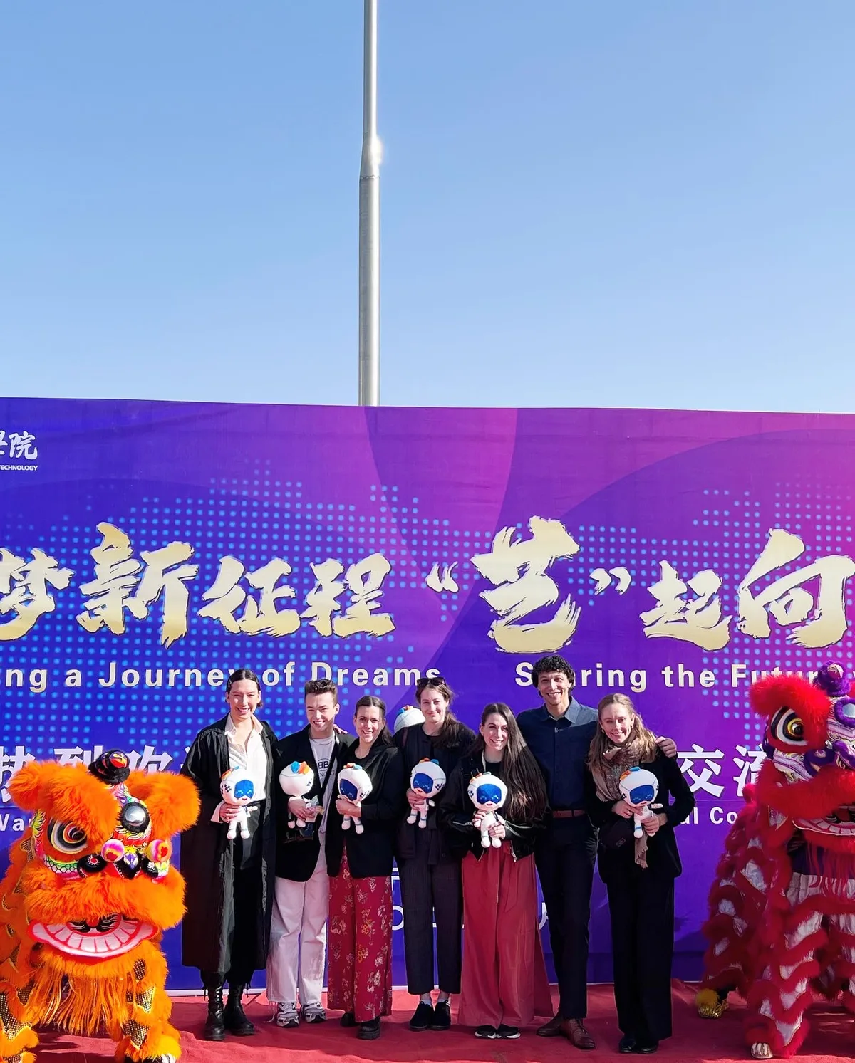 Troupe at ceremony with traditional lion dancers