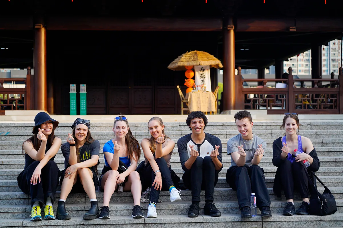 North Star troupe sitting on temple steps