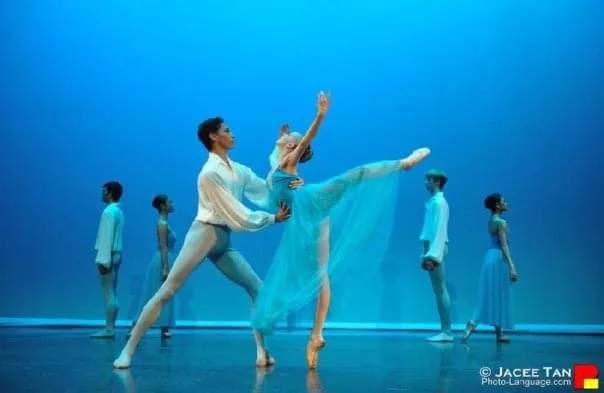 Pas de deux performance with blue lighting