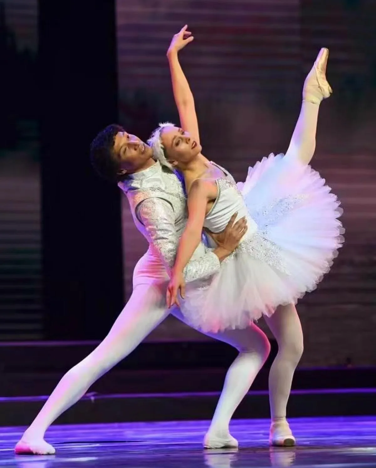 Pas de deux with purple stage lighting
