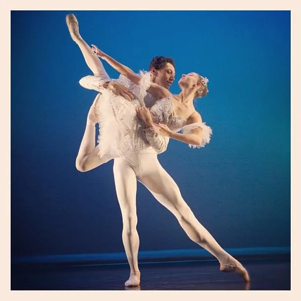 Pas de deux in white costumes