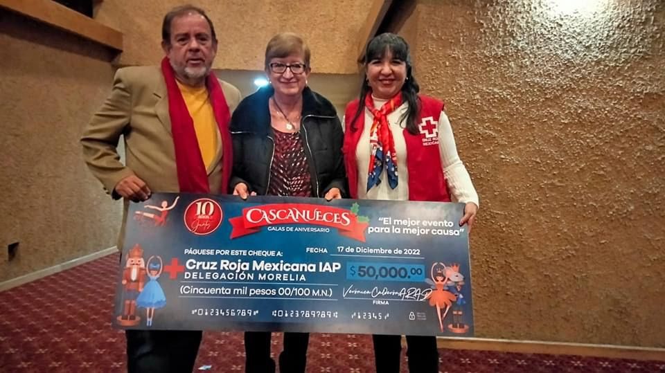 Presenting donation cheque on stage at The Nutcracker, 2022